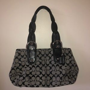 Black and silver coach purse
